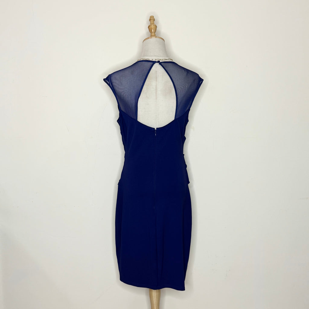 Navy blue dress on a mannequin against a white background