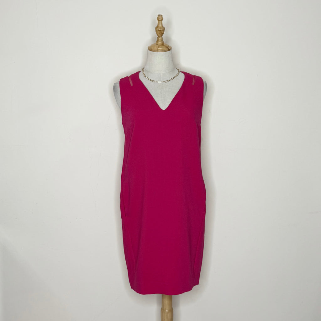 Red dress on a mannequin against a white background
