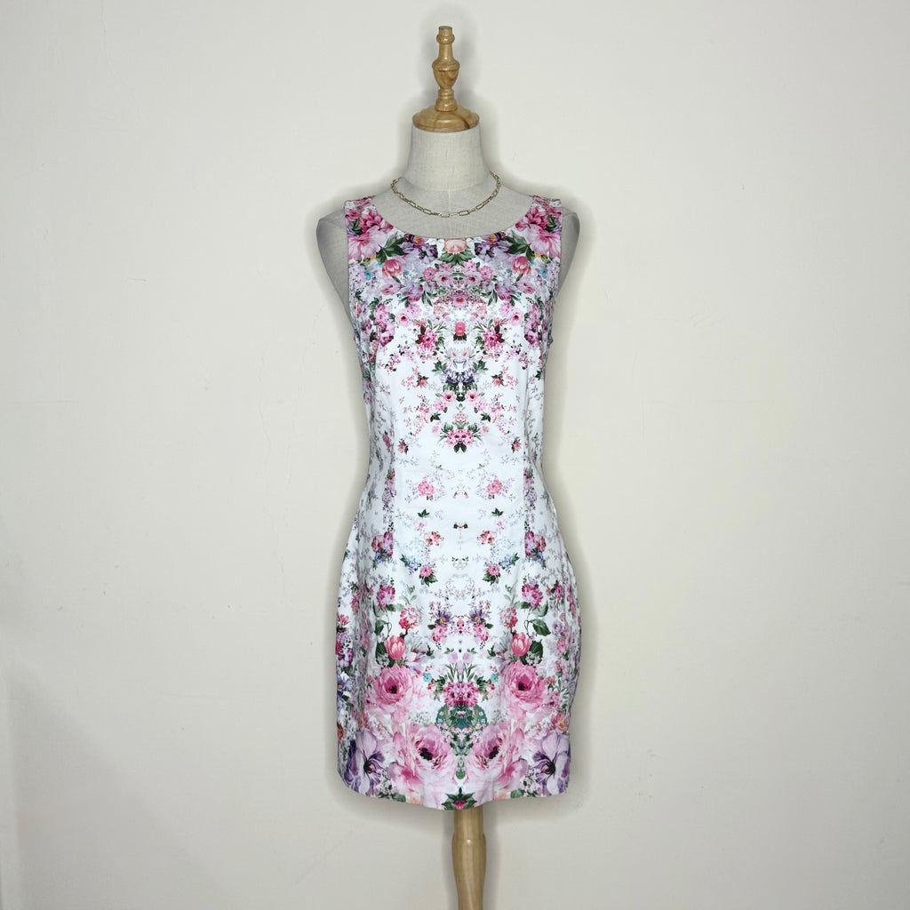 Floral dress on a mannequin against a plain background