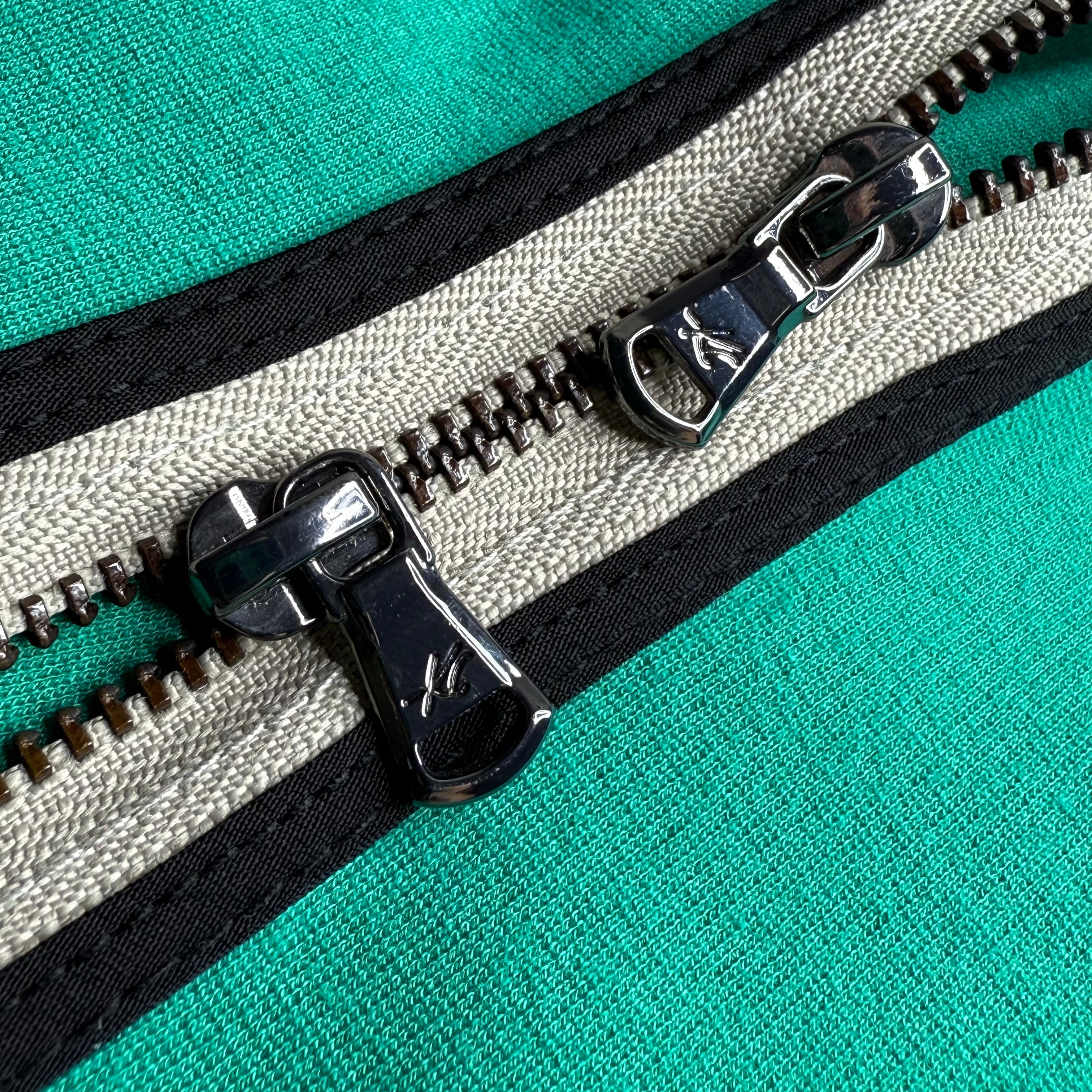 Close-up of a zipper on a fabric background