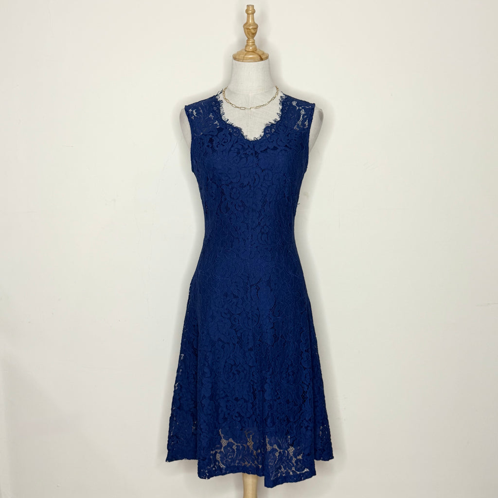 Blue lace dress on a mannequin against a white background