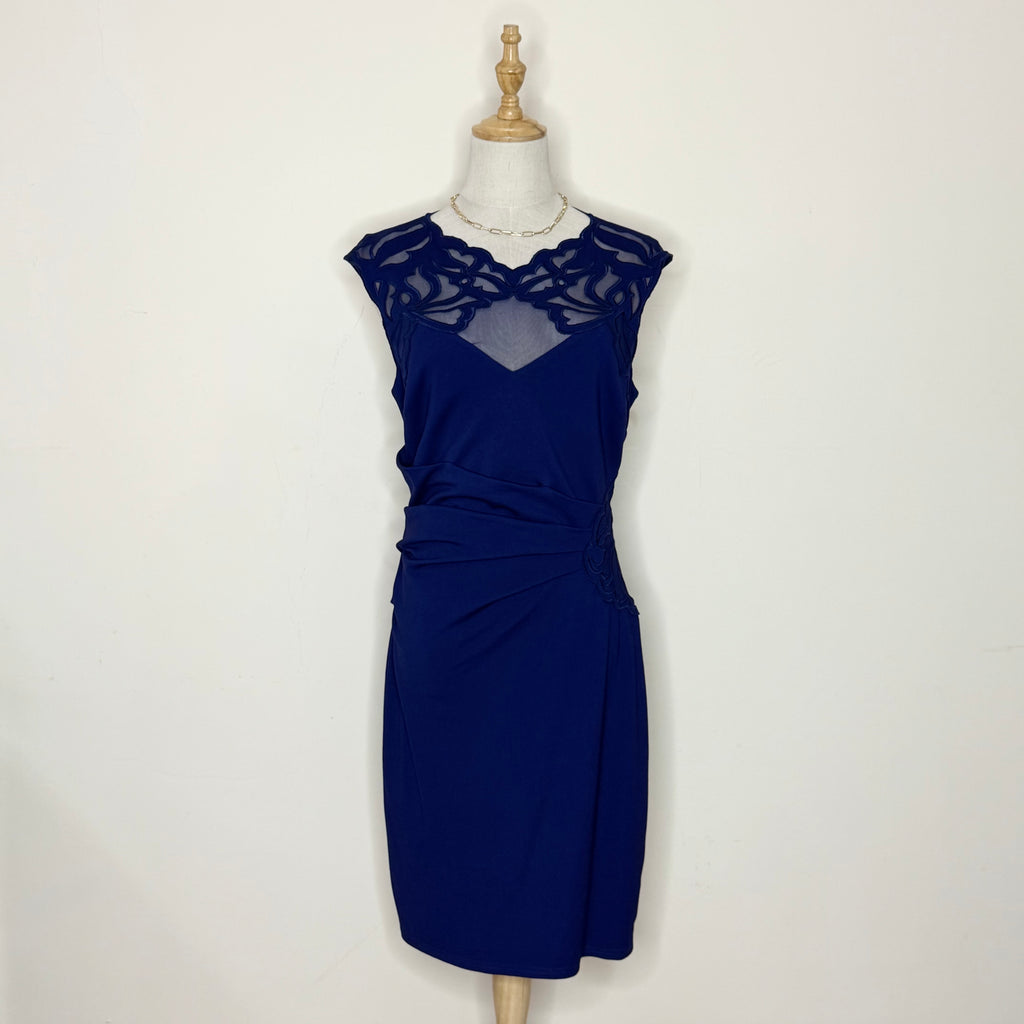 Navy blue dress on a mannequin against a white background