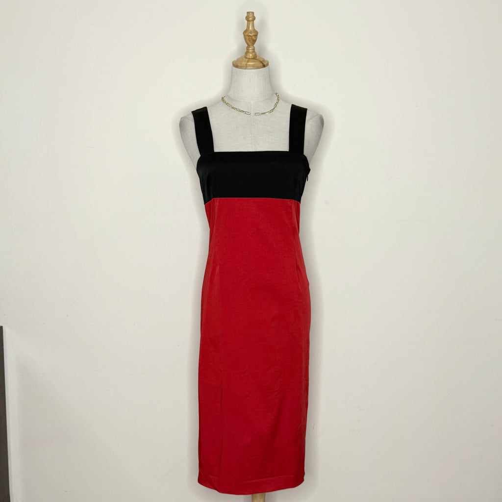 Red and black dress on a mannequin against a white background